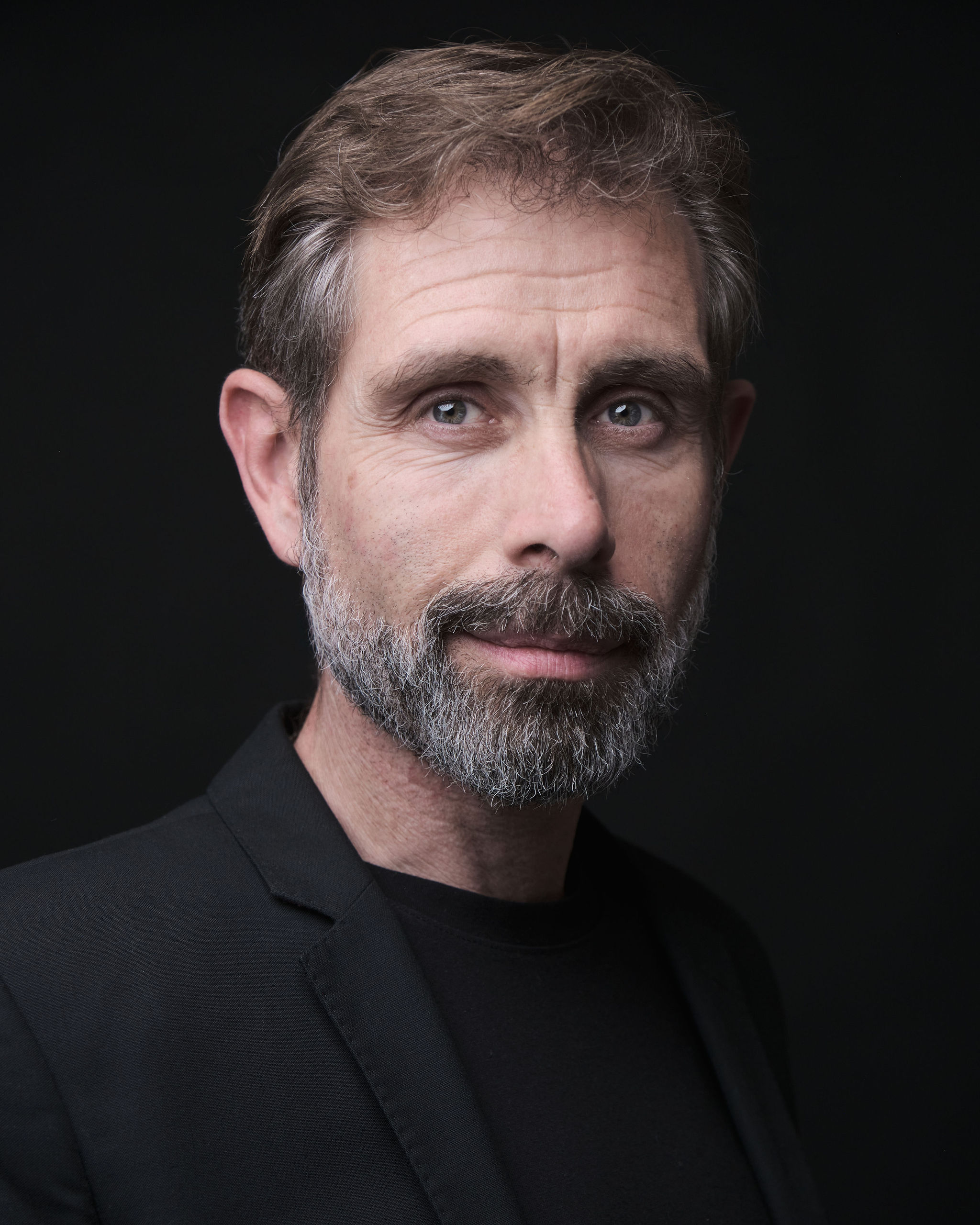 Iago Cabrero actor — Authority Figure, frontal portrait, pink shirt and dark jacket